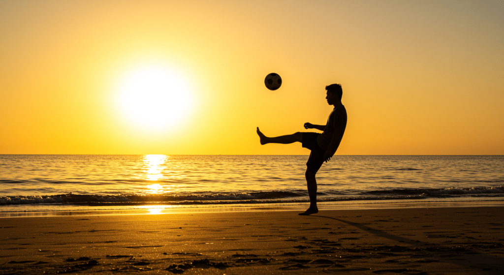 Cosas que no sabías del fútbol: datos curiosos que te sorprenderán 6 Silueta de persona jugando al fútbol en la playa al atardecer. Imagen tranquila y luminosa, ideal para artículos sobre deportes, playas, atardeceres y estilo de vida saludable.