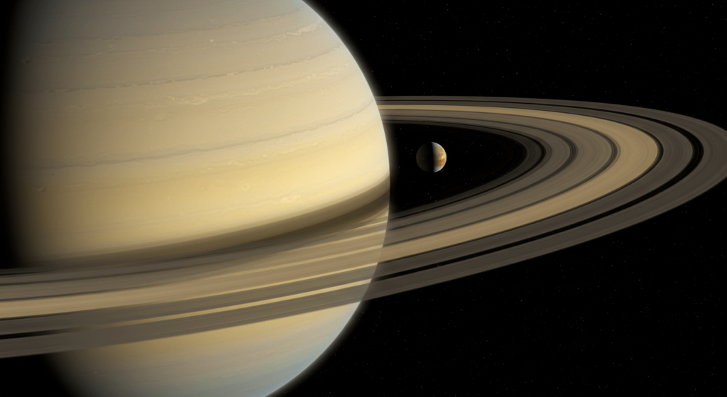Titán, la luna que podría ser una segunda Tierra 5 "Fotografía de Saturno y su luna Titán mostrando la majestuosidad del planeta anillado. Explotación espacial de Saturno que permite ver la belleza de Saturno."