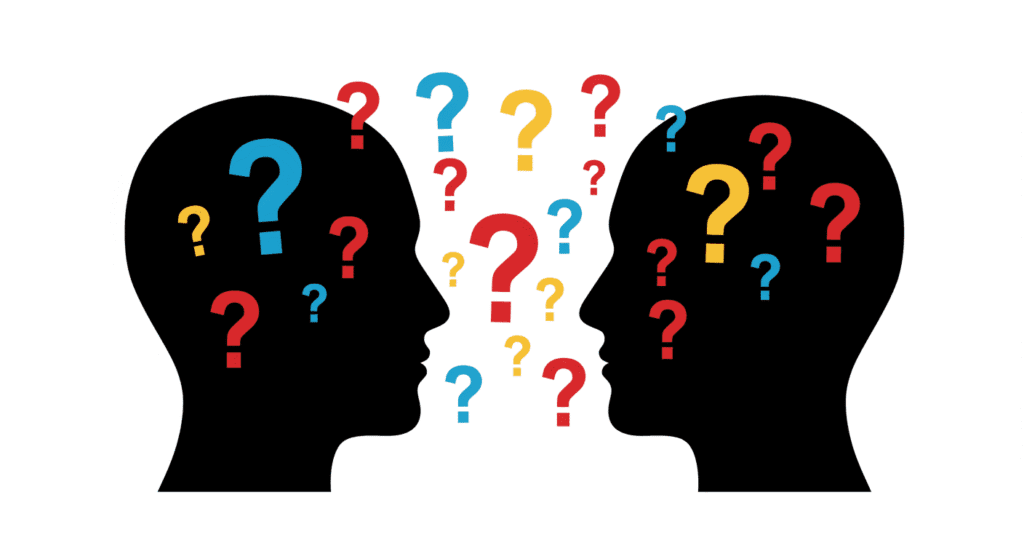 Siluetas enfrentadas con signos de interrogación. Comunicación, preguntas.