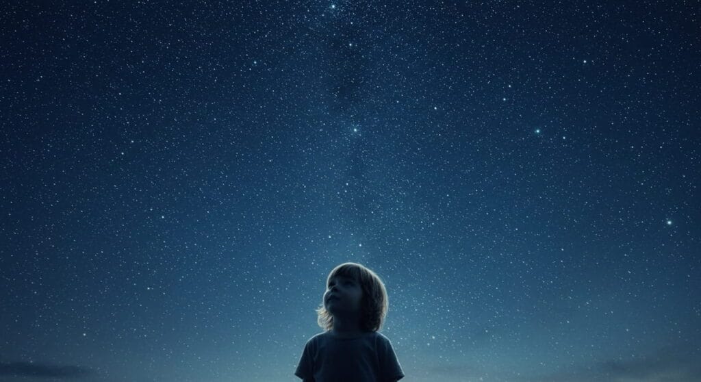 Niño curioso mirando el cielo como símbolo de la curiosidad en la inteligencia humana.